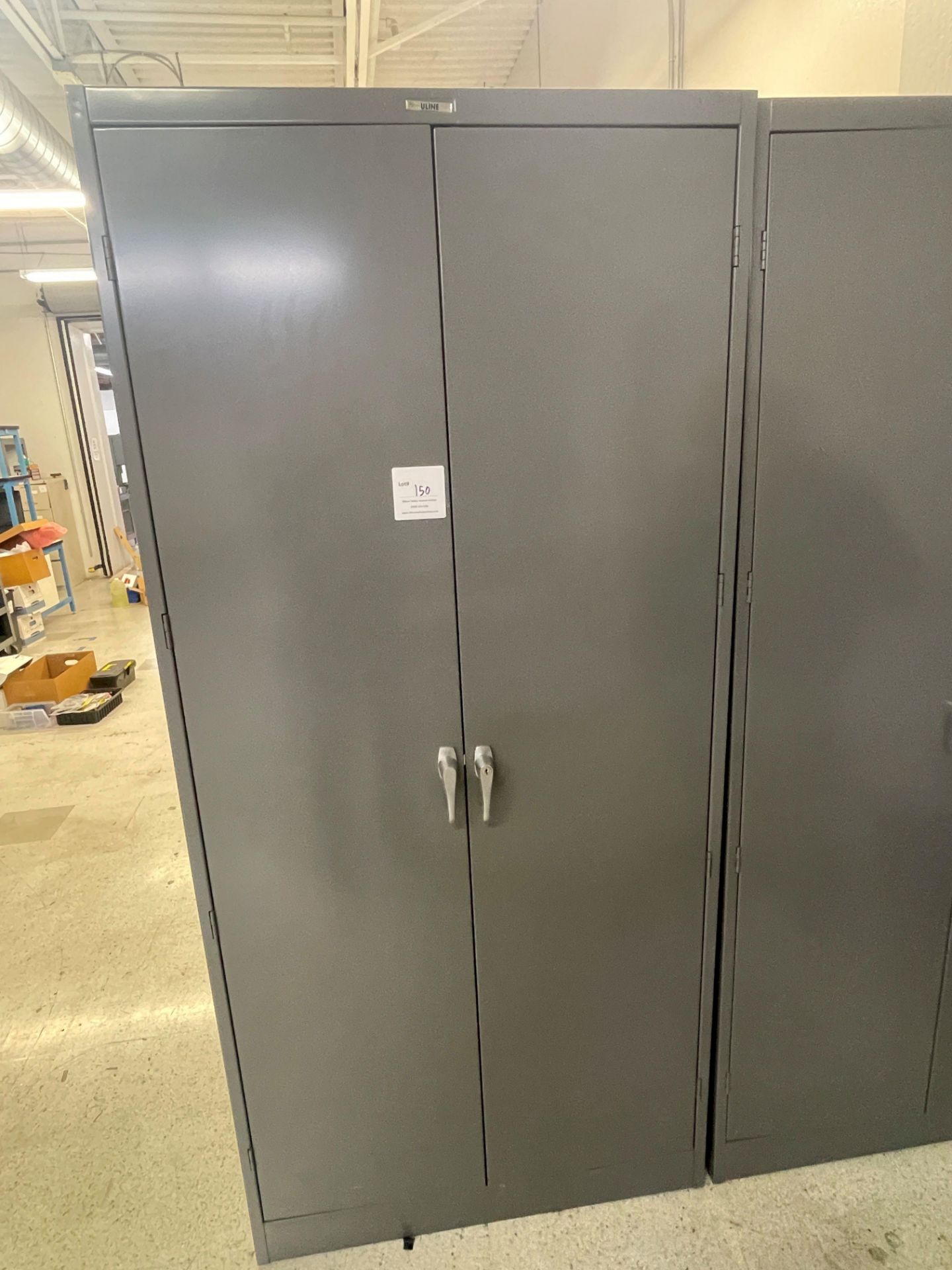 Grey metal storage cabinet with two doors 36" wide x 18" deep x 78" high