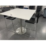 White Square Table with metal base 42" wide x 42" deep x 42" high and two black chairs