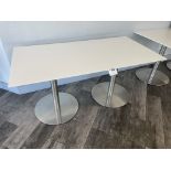 White Table with metal base 60" wide x 30" deep x 29" high and two black chairs