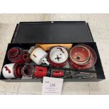 Various hole saws in metal box