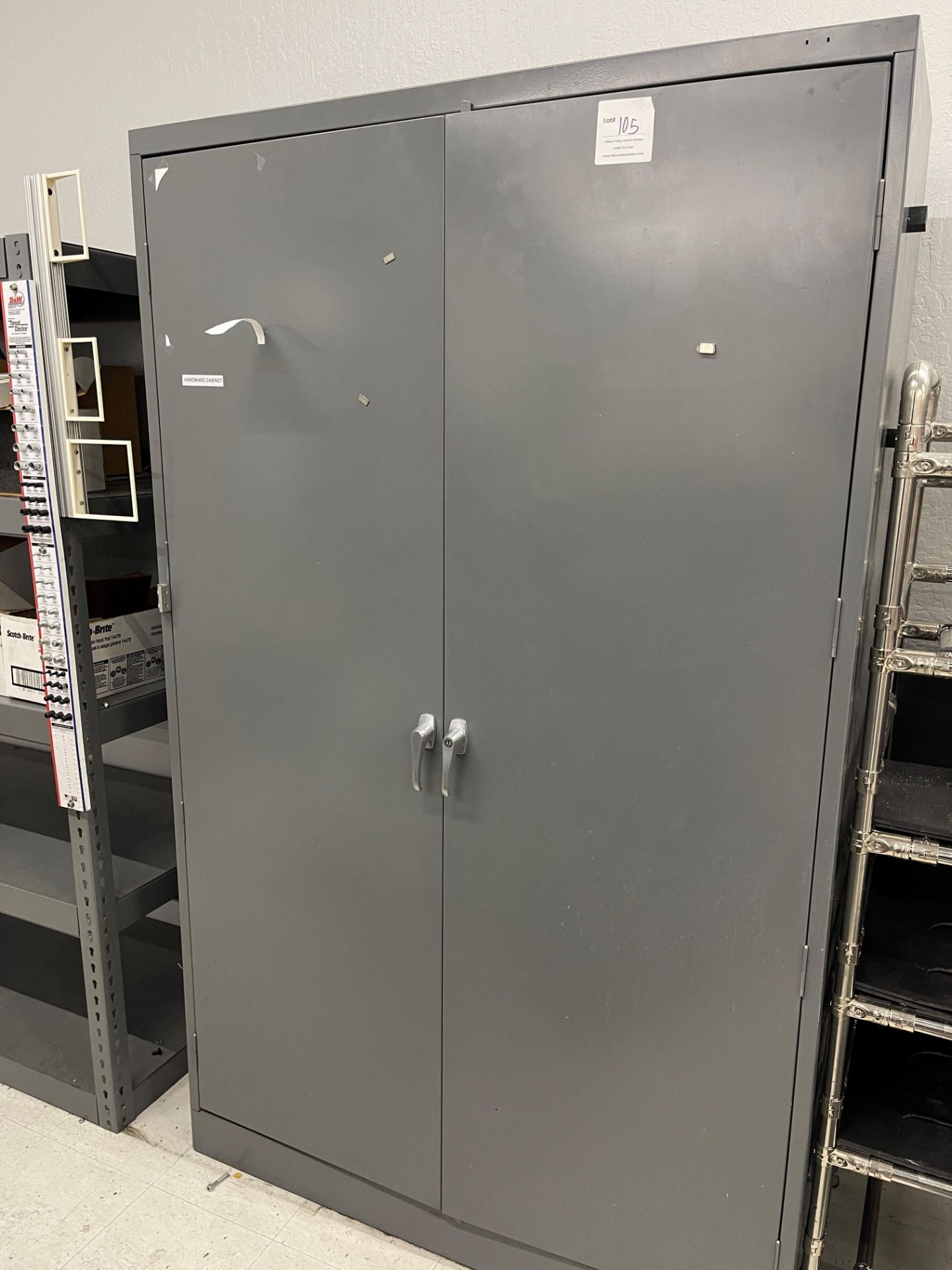 Grey metal two door storage cabinet 48" wide x 18" deep x 78" high