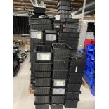 Various black containers and lids, dfferent sizes