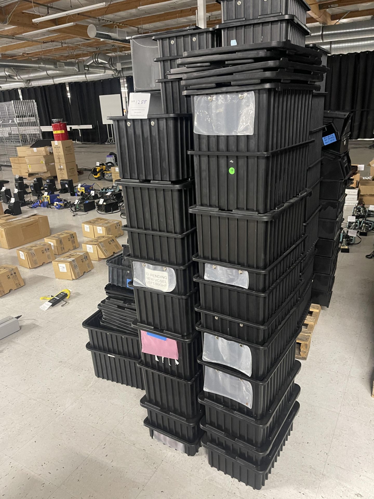 Various black containers and lids, dfferent sizes