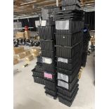 Various black containers and lids, dfferent sizes