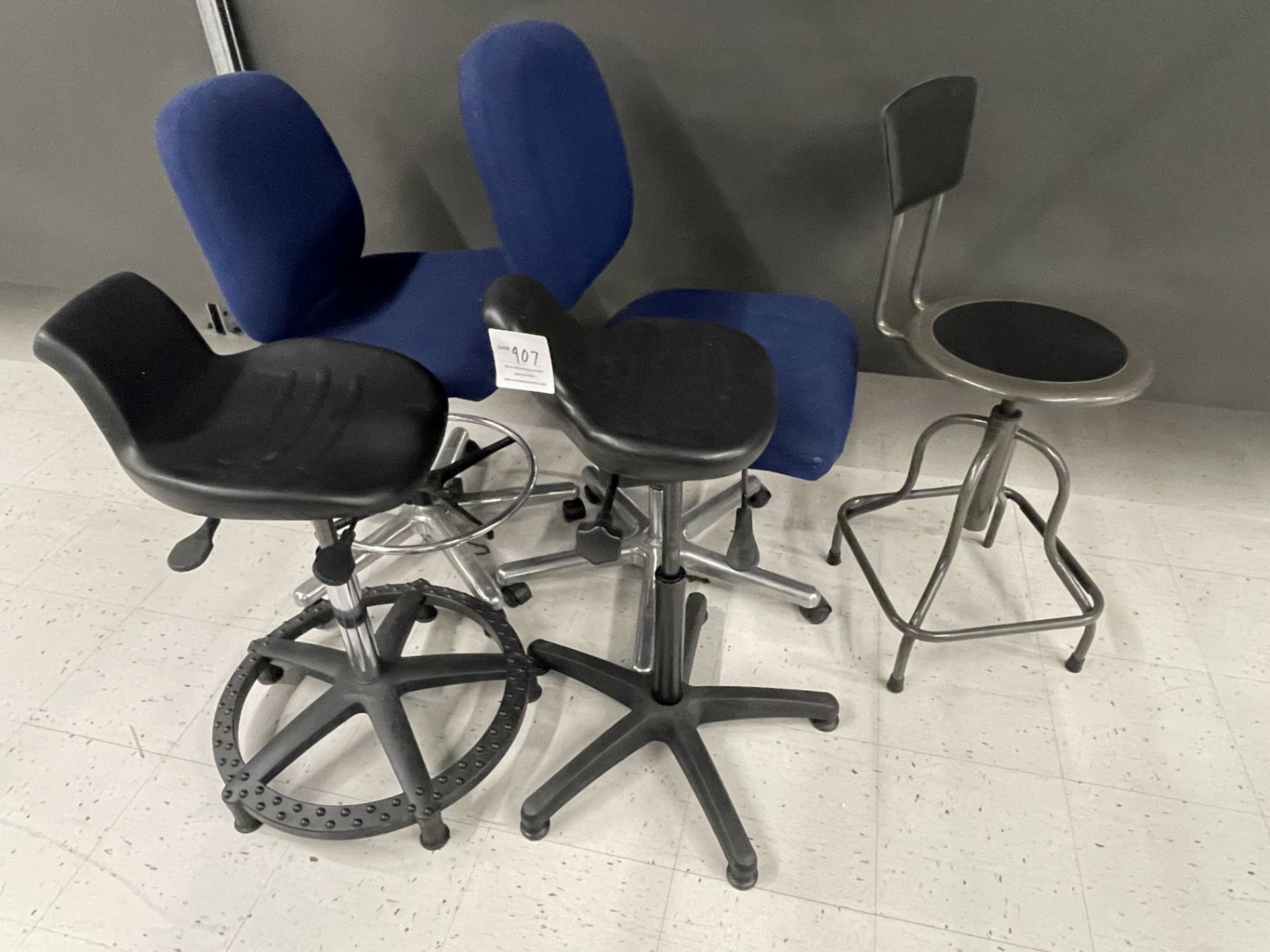 Qty five - Various work bench chairs, some adjustable