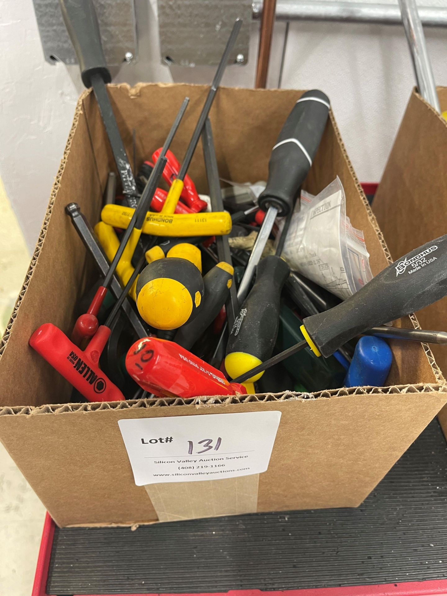 Box of miscellaneous hex keys and screwdrivers