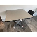 White Table with metal base 42" wide x 42" deep x 30" high and two black chairs