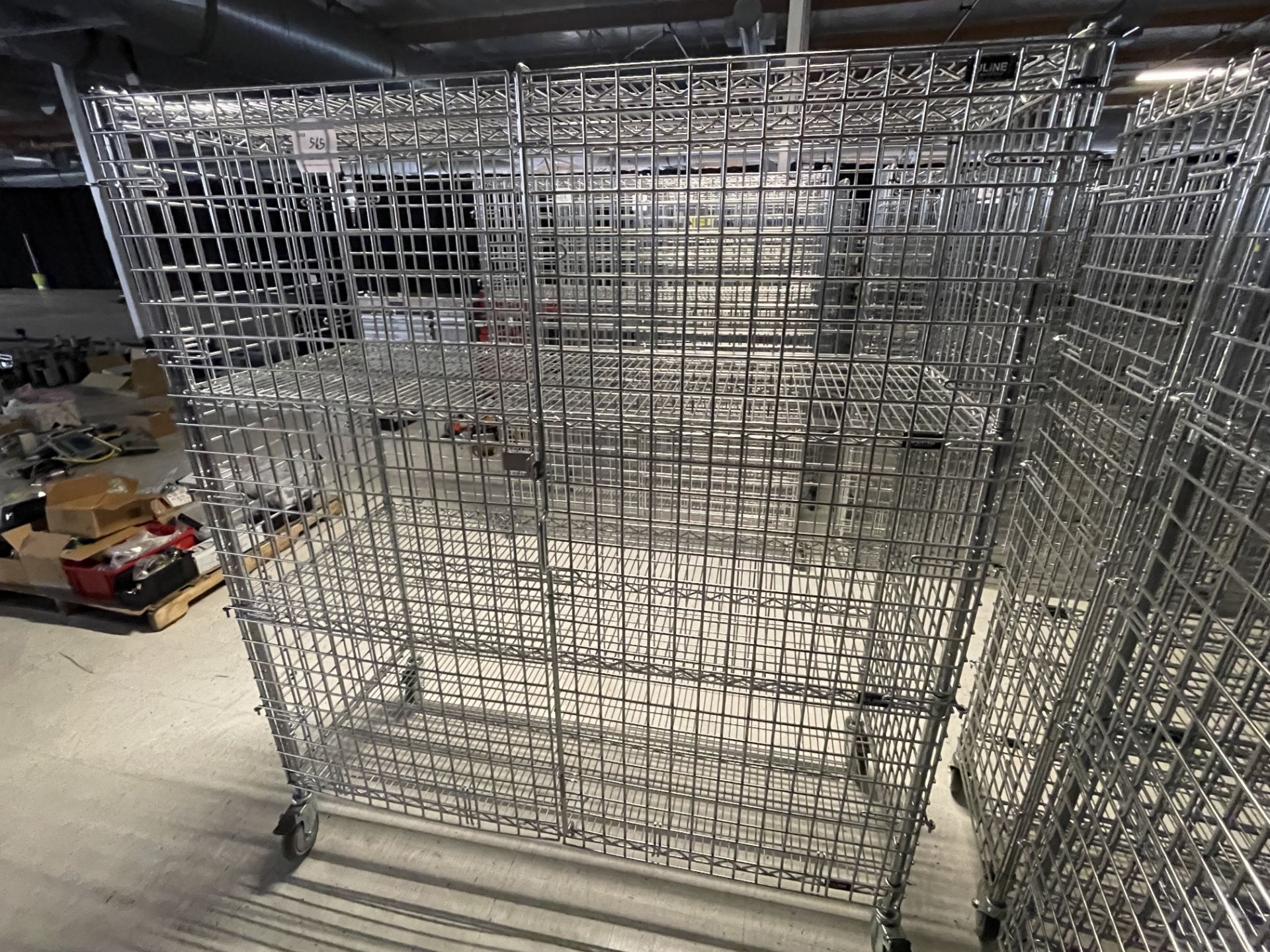 Wire Security Cage on wheels wth three shelves 60" wide x 25" deep x 70" high