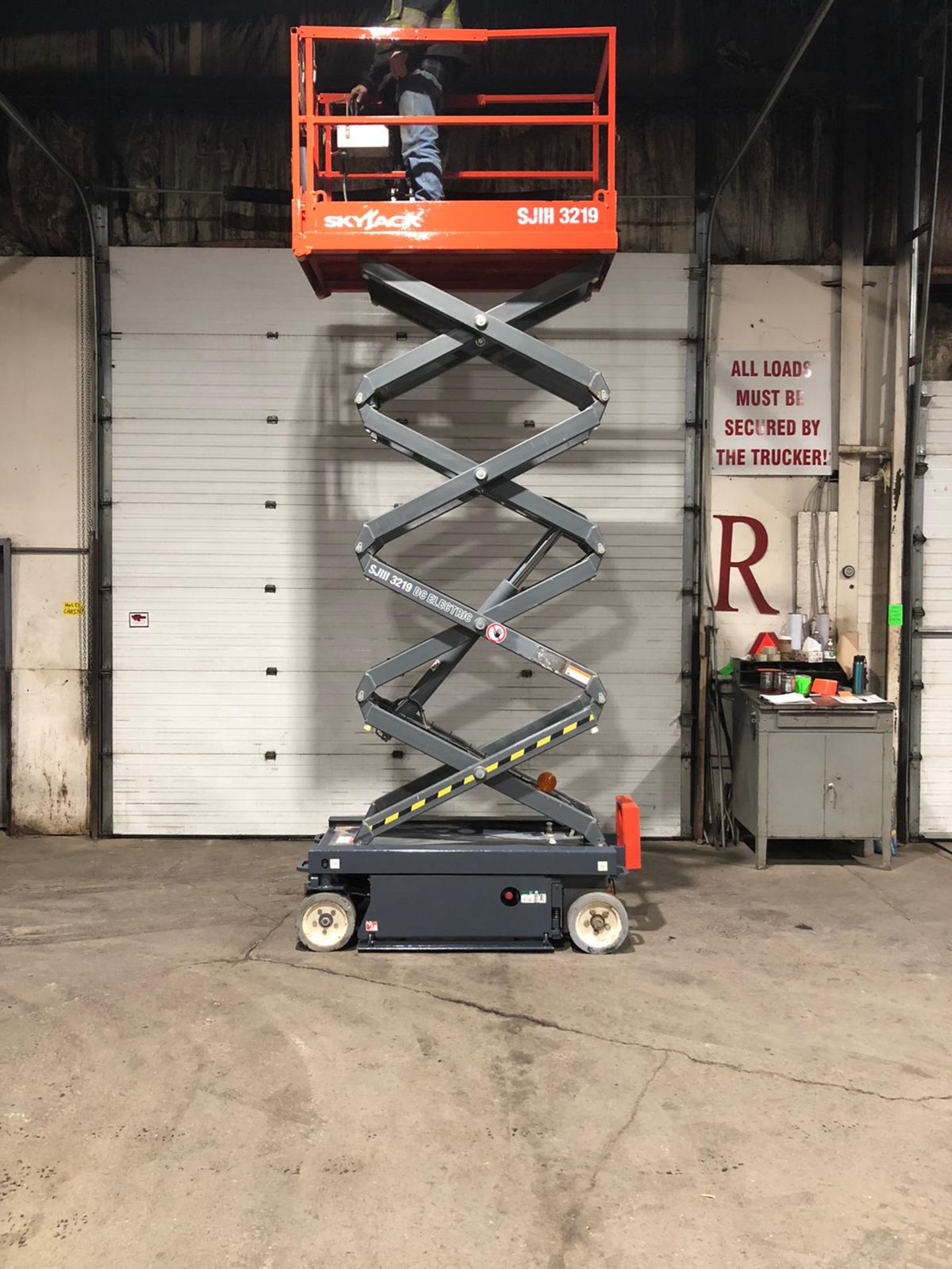 2013 SkyJack III Electric Scissor Lift model 3219 - 19 feet lift, 32 inch width deck with pendant