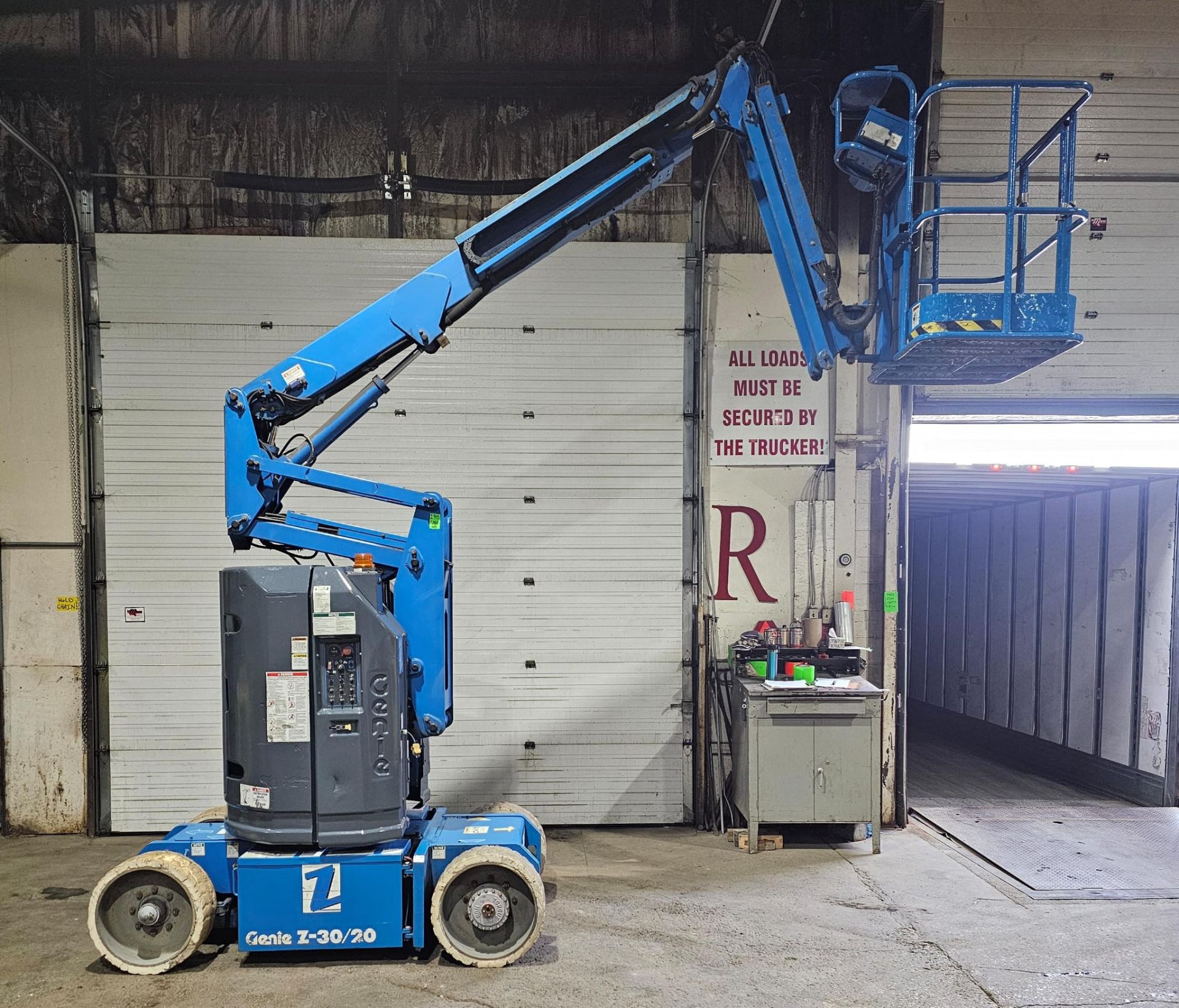 Genie model Z-30/20 Zoom Boom Electric Motorized Man Lift - with 48V Battery with non-marking tires,