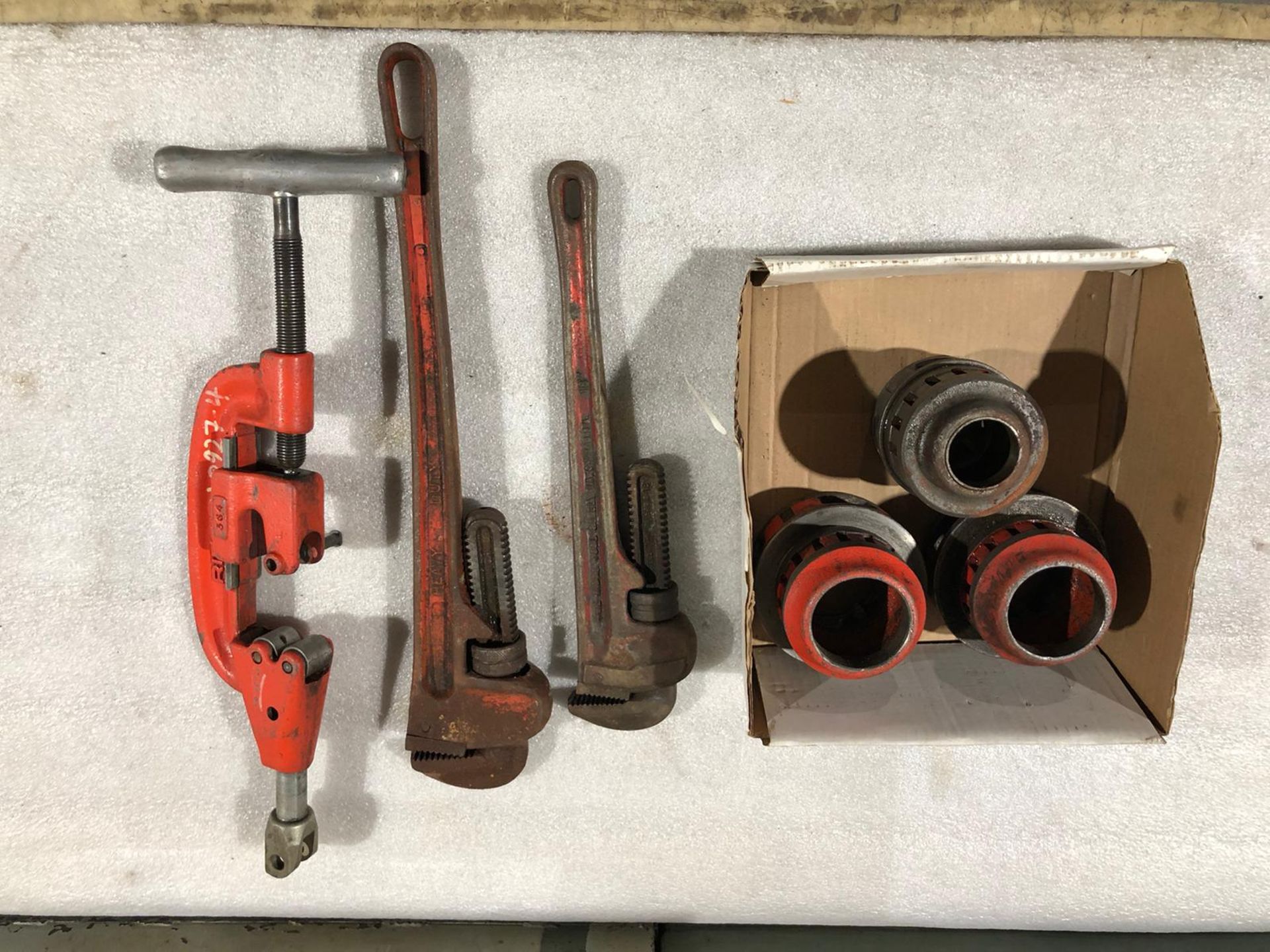Lot of Ridgid pipe threading dies and wrenches and cutter