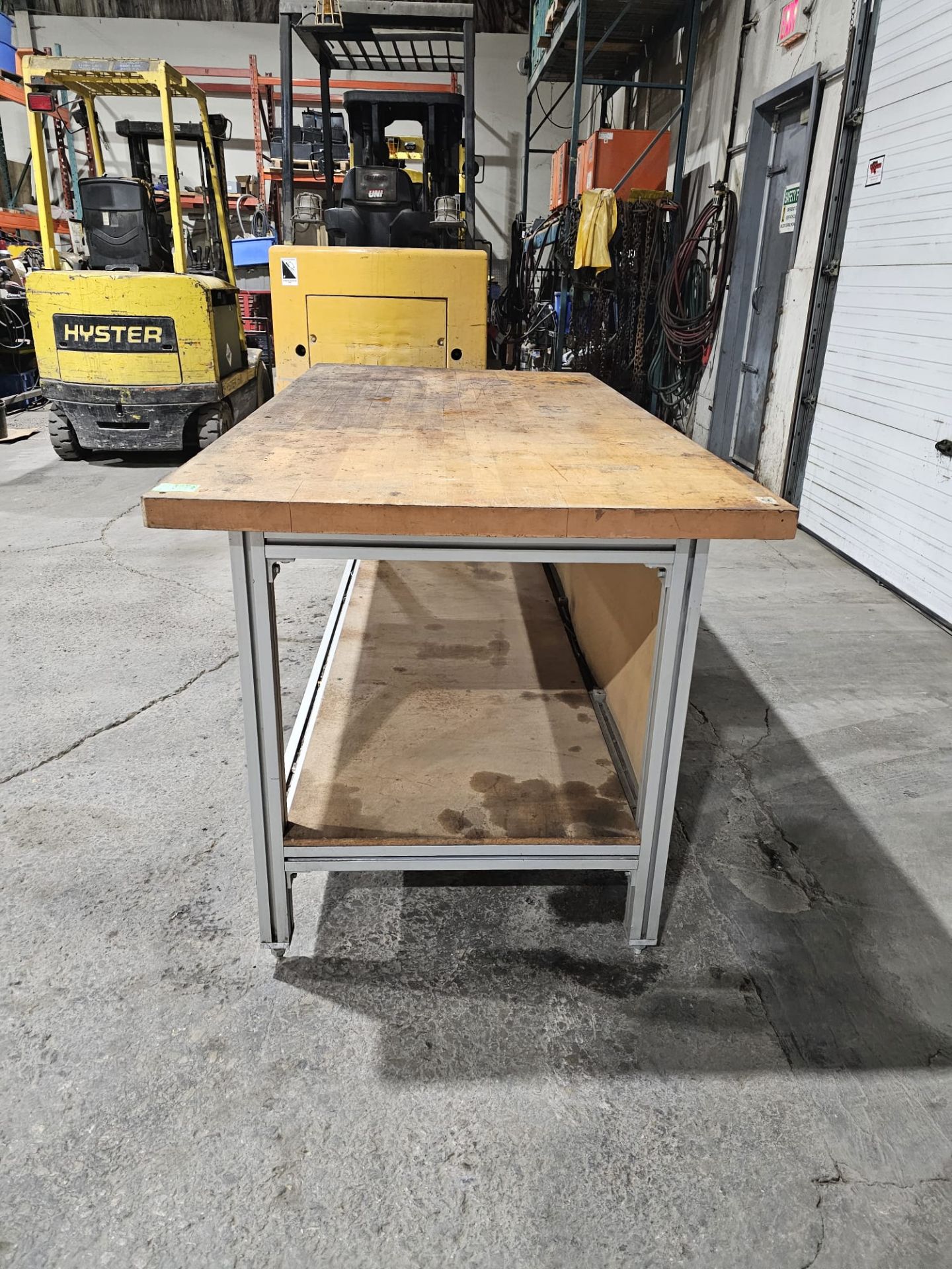 Table 36" x 72" x 34.5"h bottom shelf: 24" w x 69" - Aluminum frame with wooden top - Image 5 of 6