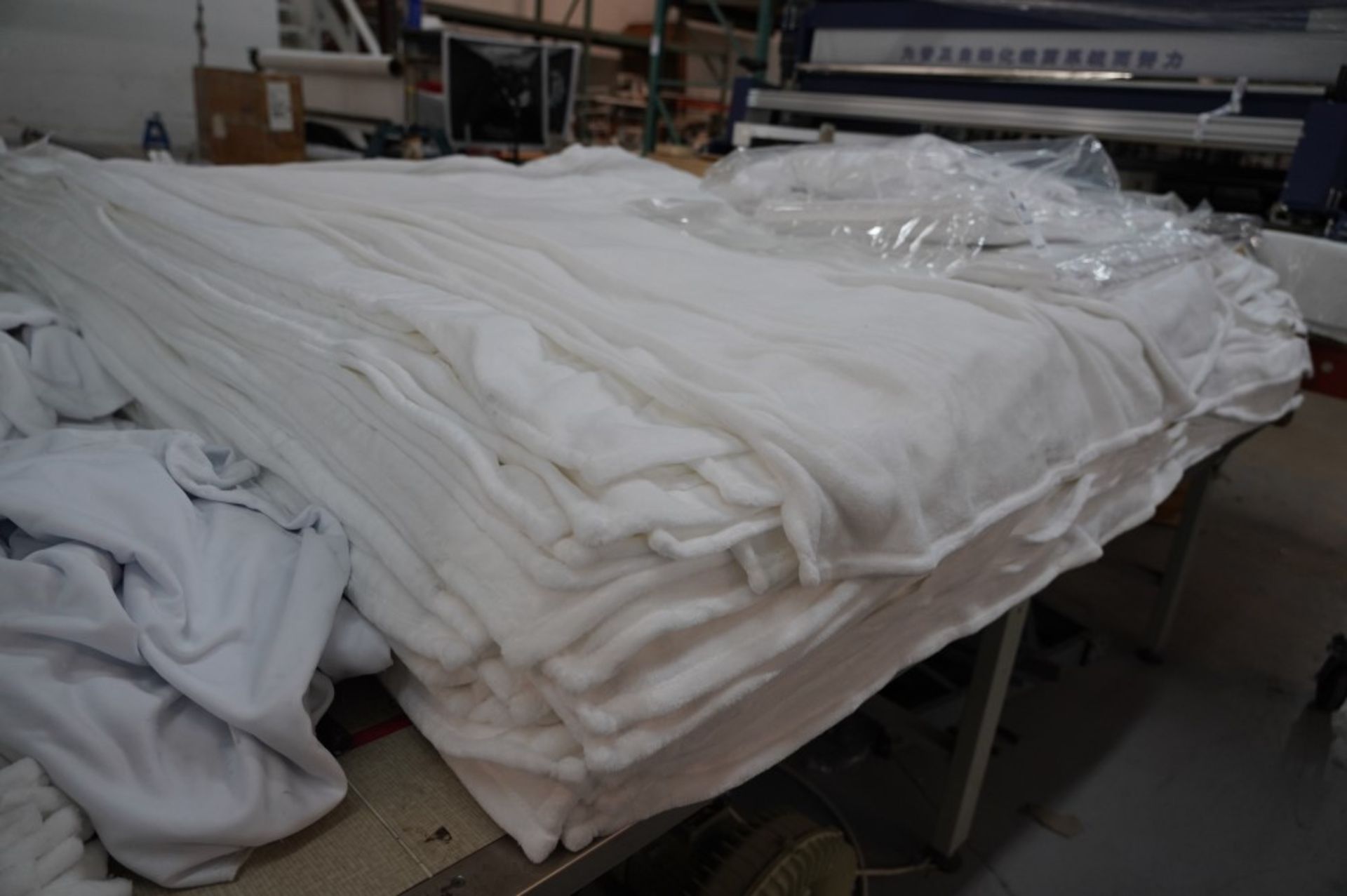 (2) Stacks of Blankets and (2) Stacks of Clothe Material, (1) Fleece White 60'' x 80'' , (1) Fleece - Image 4 of 7