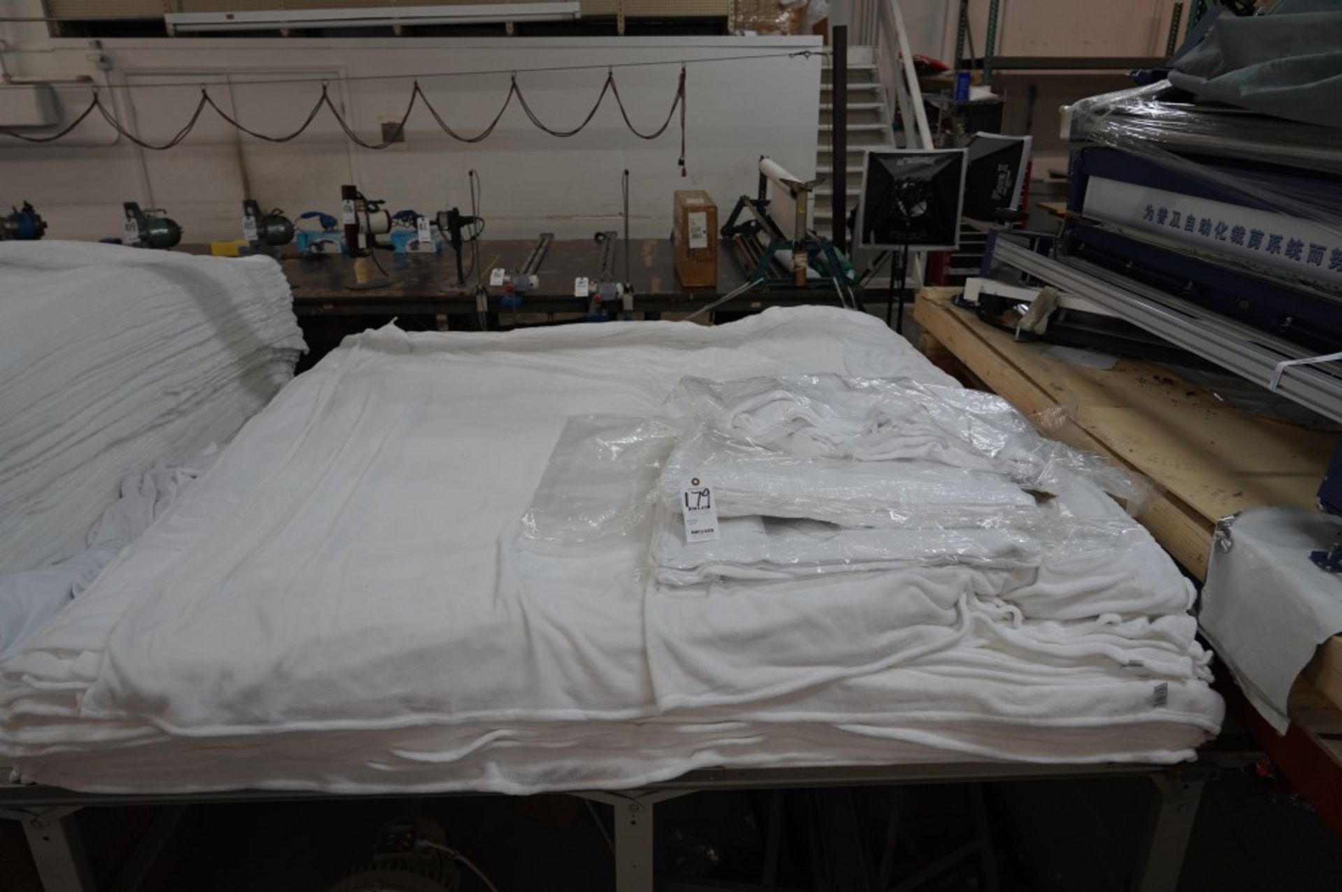 (2) Stacks of Blankets and (2) Stacks of Clothe Material, (1) Fleece White 60'' x 80'' , (1) Fleece - Image 2 of 7
