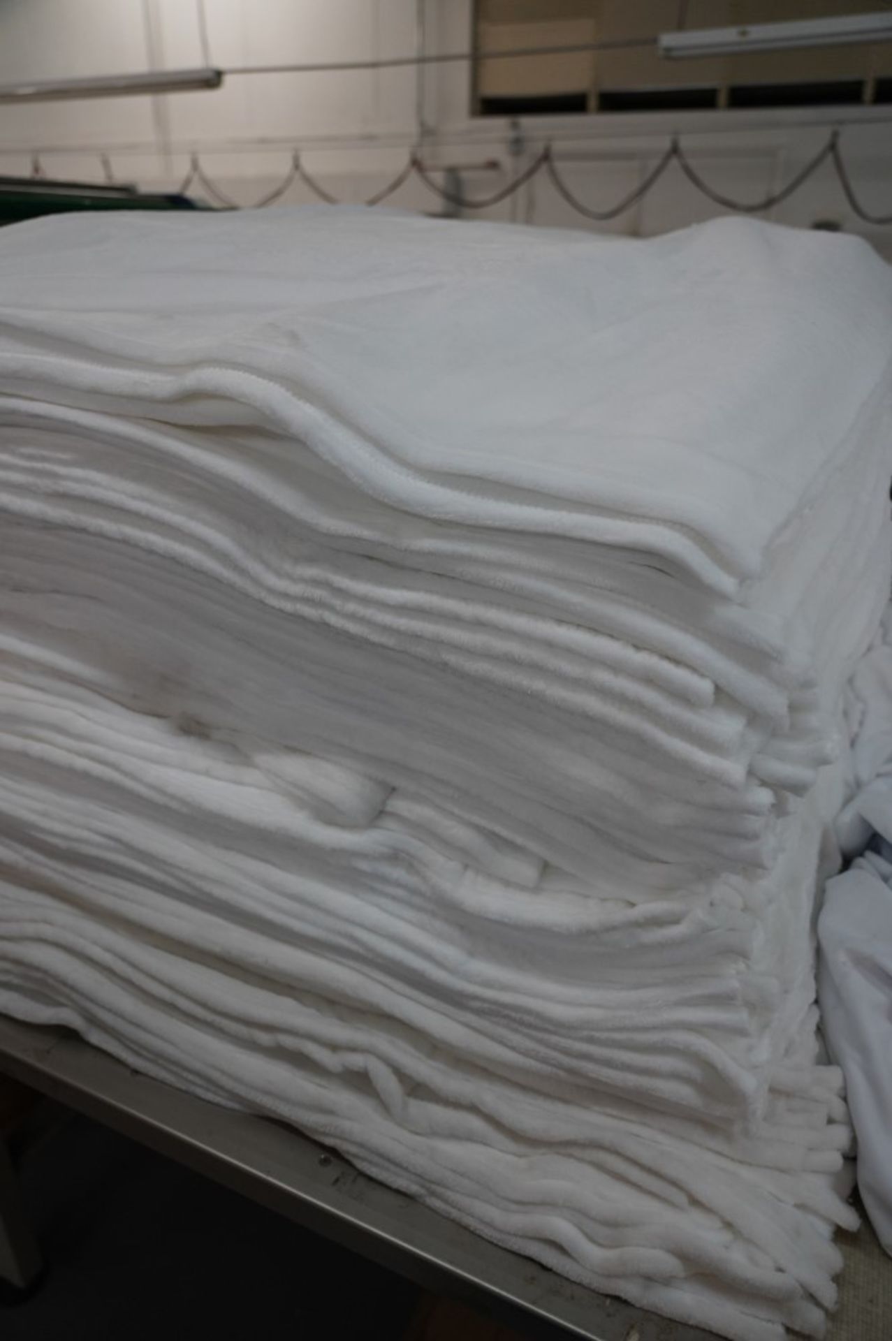 (2) Stacks of Blankets and (2) Stacks of Clothe Material, (1) Fleece White 60'' x 80'' , (1) Fleece - Image 5 of 7
