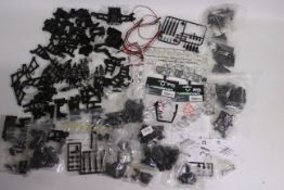 Kyosho - Absima - Other - A large collection of predominately loose plastic spare parts and