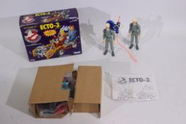 Kenner - A boxed Ghostbusters Ecto-3 Vehicle # 81050 and 2 x unboxed Egon figures.