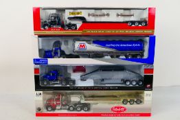 First Gear - 4 x boxed American trucks in 1:50 scale, Mack Granite MP with Tri-axle Lowboy Trailer,