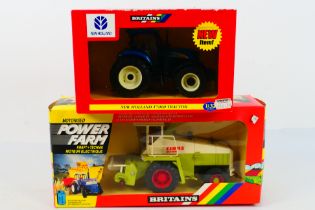 Britains. Two boxed Britains Tractors appearing in VG condition in Poor - Good boxes.