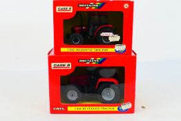 Britains. Two boxed Britains Tractors appearing in VG condition in Fair boxes.