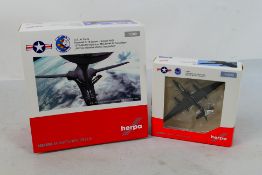 Herpa - Two boxed diecast 1:200 scale military aircraft from Herpa. Lot consists of 559263 U.S.