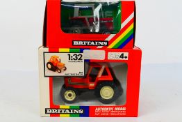 Britains. Two boxed Britains Tractors appearing in VG condition in Good boxes.