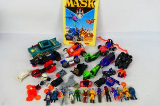 Mask - Kenner - A loose collection of 13 MASK action figures with a group of unboxed MASK Vehicles,