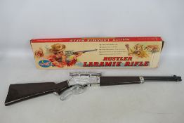 Crescent - A boxed 1960 Rustler Laramie 100 Shot Cap Repeating Rifle # 90/S.