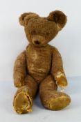 Steiff - A large 32" tall jointed straw filled bear.