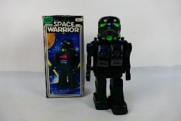 Star Wars - A Hong Kong made plastic "Space Warrior" battery operated robot.