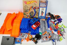 Hot Wheels - A collection of Hot Wheels Track Builder and Mega Sets parts with 4 x vehicles.