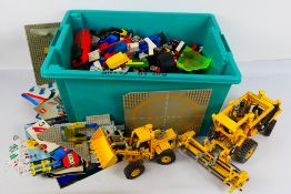 Lego - Two built Lego construction vehicles with a large quantity of loose Lego bricks and parts