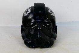 Star Wars - A 1997 Don Post hard plastic adult sized Star Wars Imperial Tie Fighter Helmet.