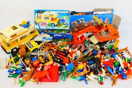 Playmobil - A large quantity of loose and unboxed Playmobil figures, vehicles and accessories.