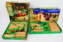 Brio - Toymaster. Two vintage boxed Brio / Toymaster wooden Train Sets with magnetic engines.