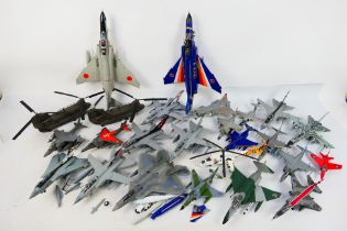 25 built model military aircraft plastic kits in various scales from numerous manufacturers.