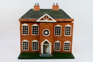 Dolls house - A home made, wooden, tiled, dolls house.