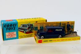Corgi - A boxed B.M.C. Mini Police van with Police officer and tacker dog # 448.