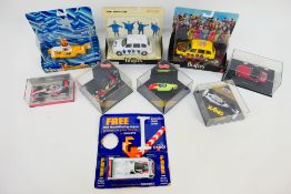 Corgi - Quartzo - Minichamps - Jouef - A group of boxed / carded models including The Beatles Taxi,