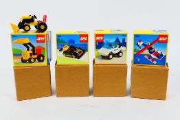 Lego - Four boxed Lego sets.