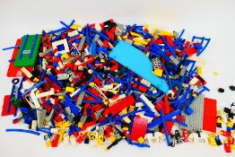 Lego - Mixed a box full of lego pieces containing wheels, rods, windows, bricks, motorcycles,