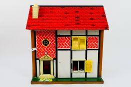 Toy Works - A 1970s wooden 4 room dolls house with furniture by Toy Works.