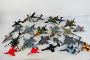 24 built model military aircraft plastic kits in various scales from numerous manufacturers.