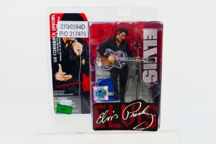 McFarlane Toys - A carded McFarlane Toys 'Elvis - 68 Comeback Special' action figure.
