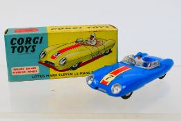 Corgi - A boxed Lotus Mark Eleven Le Mans racing car in blue with driver figure # 151A.