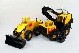 Tonka - 2 x tin plate Tonka construction vehicles - Lot includes a yellow Mighty Turbo Loader truck.