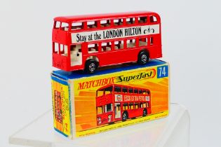 Matchbox - A boxed Daimler Bus # 74 in the sought after Hilton livery with Kensington on one side