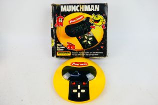 Munchman - Grandstand - Namco - Tomy. A boxed fully functional Munchman with Styrofoam inserts.
