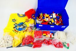 Lego - Children's Jumper - Loose lego. A light fabric box containing 3.