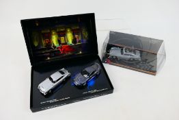 Minichamps - Corgi - 2 x boxed James Bond car sets,